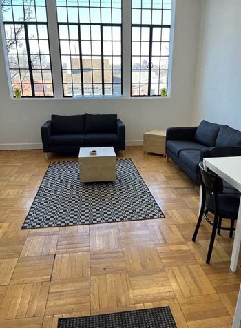 a living room with two couches and a table